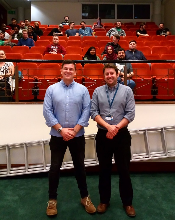 Two boy with studs behind